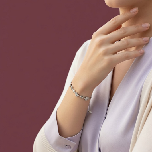 Silver bracelet featuring charming pave-set and crystal flowers with smooth silver hearts.