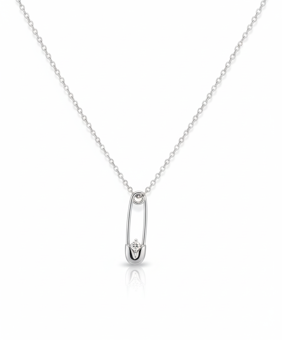 Elegant silver safety pin pendant with a sparkling stone