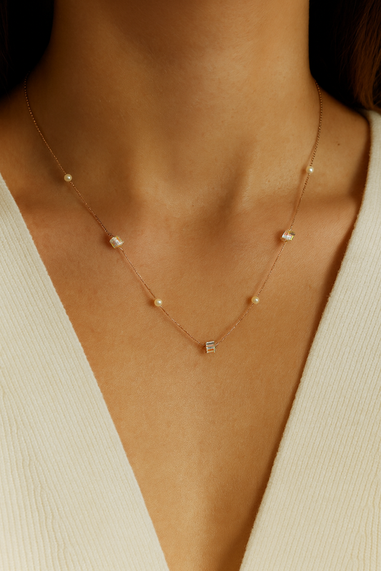 Delicate rose gold necklace adorned with pearls and crystals