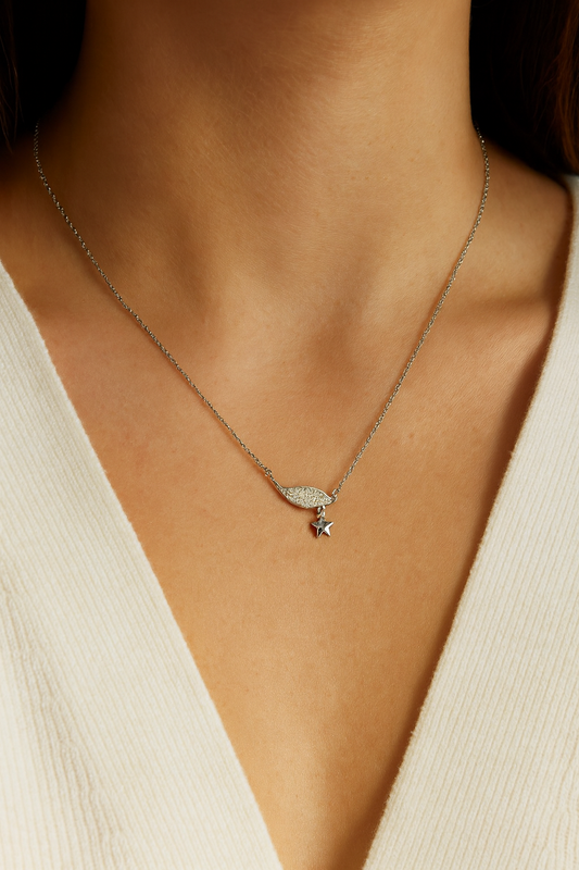 Elegant silver pendant featuring a sparkling wing design with a dangling star charm