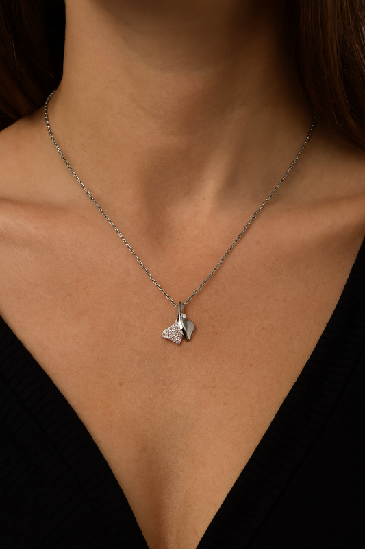 Elegant silver pendant featuring dual heart charms