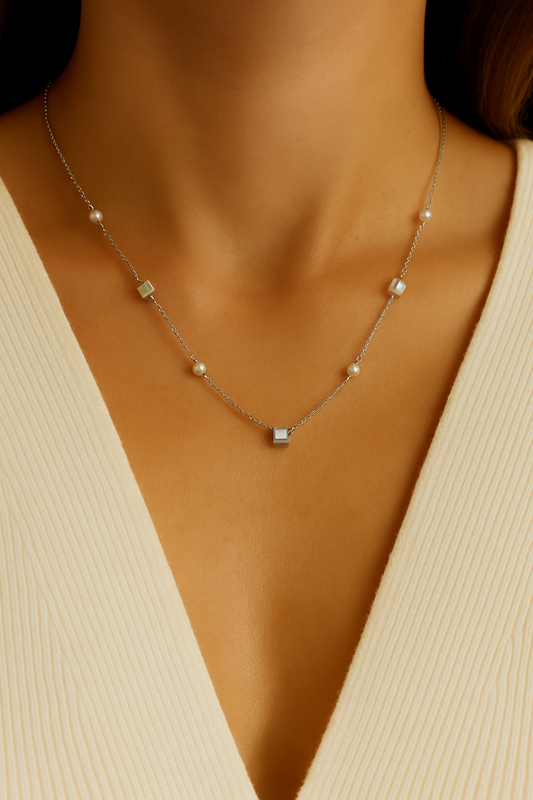 Delicate silver necklace adorned with pearls and crystals