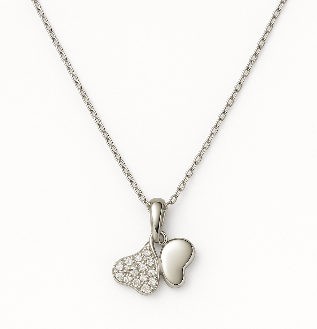 Elegant silver pendant featuring dual heart charms
