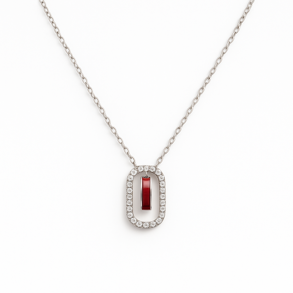 Elegant silver necklace featuring a deep red gemstone framed with sparkling stones