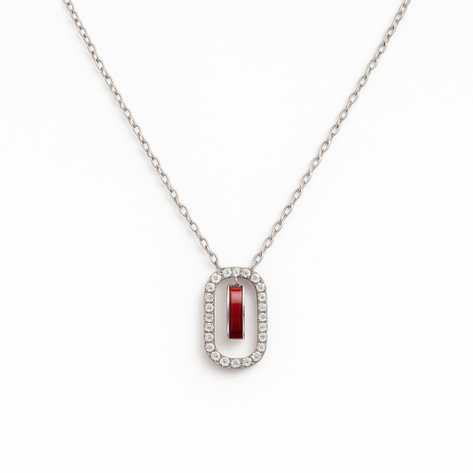 Elegant silver necklace featuring a deep red gemstone framed with sparkling stones