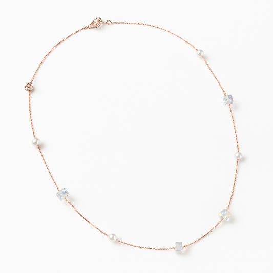 Delicate rose gold necklace adorned with pearls and crystals