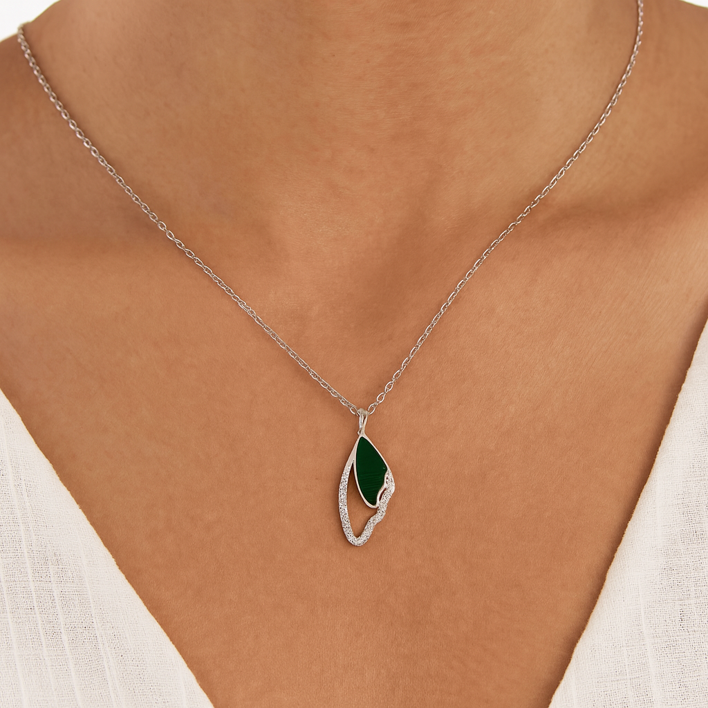 Elegant silver Butterfly Wing pendant with a touch of green enamel and sparkling stones