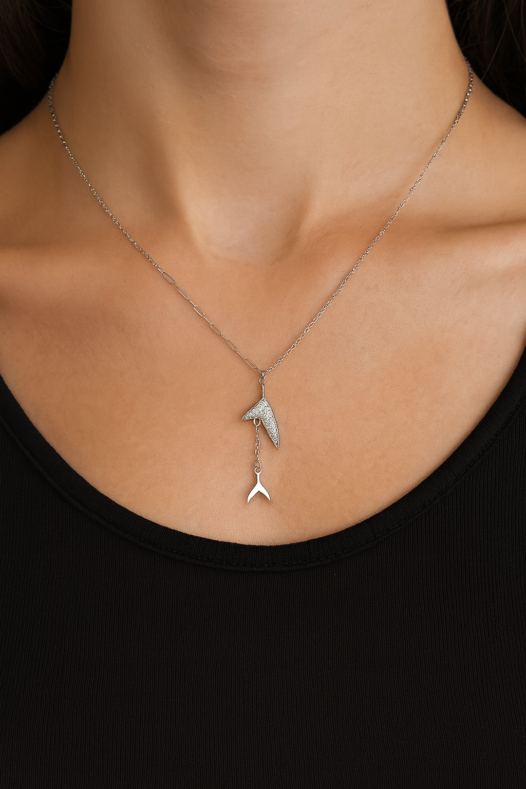 Stylish silver pendant featuring a sleek double arrow design