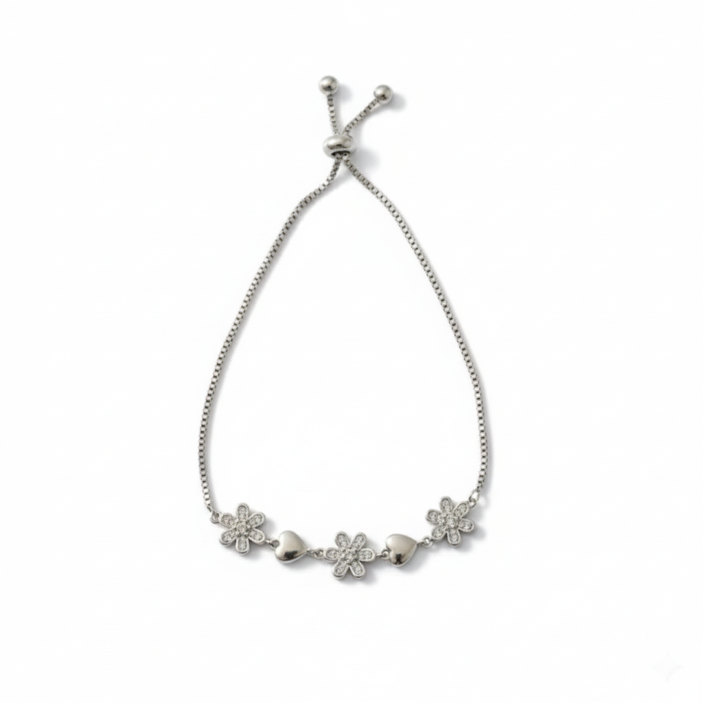 Silver bracelet featuring charming pave-set and crystal flowers with smooth silver hearts.