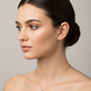 Elegant silver safety pin pendant with a sparkling stone