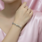 Graceful silver bracelet with blooming motifs and a sleek adjustable design