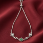 Elegant Silver-Tone Floral Bolo with Green Center