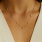 Delicate rose gold necklace adorned with pearls and crystals