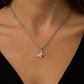 Elegant silver pendant featuring dual heart charms