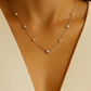 Delicate silver necklace adorned with pearls and crystals