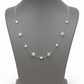 Delicate silver necklace adorned with pearls and crystals