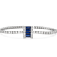 silver tennis bracelet with a bold blue crystal centerpiece