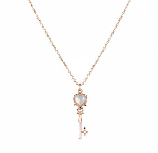 Charming rose gold key pendant with a heart design