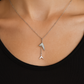 Stylish silver pendant featuring a sleek double arrow design