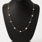 Delicate rose gold necklace adorned with pearls and crystals