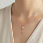 Charming rose gold key pendant with a heart design